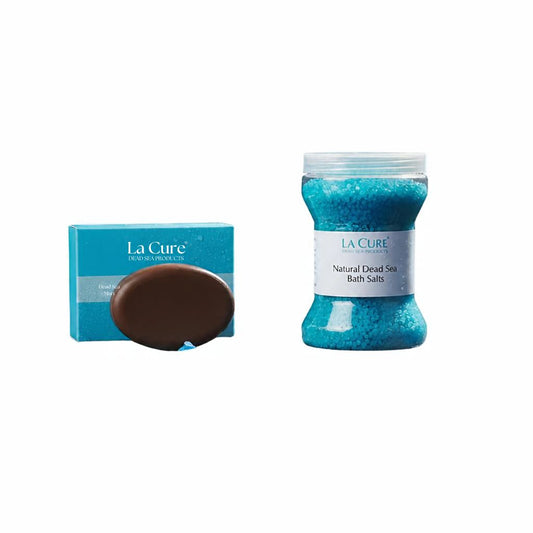 La Cure Natural Dead Sea Bath Salts shown with a blue box and a clear jar filled with bright blue salt crystals on a white background.