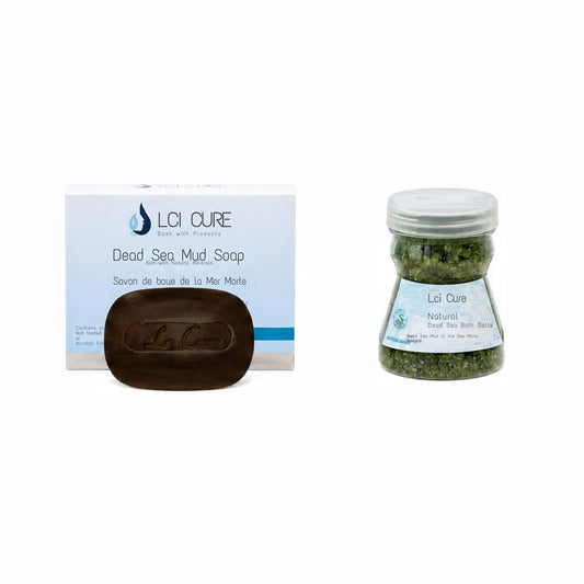 Loi Cure Dead Sea Mud Soap set, featuring a dark brown oval soap bar in front of its white and blue retail box, alongside a small clear jar filled with green salt crystals and a silver lid.